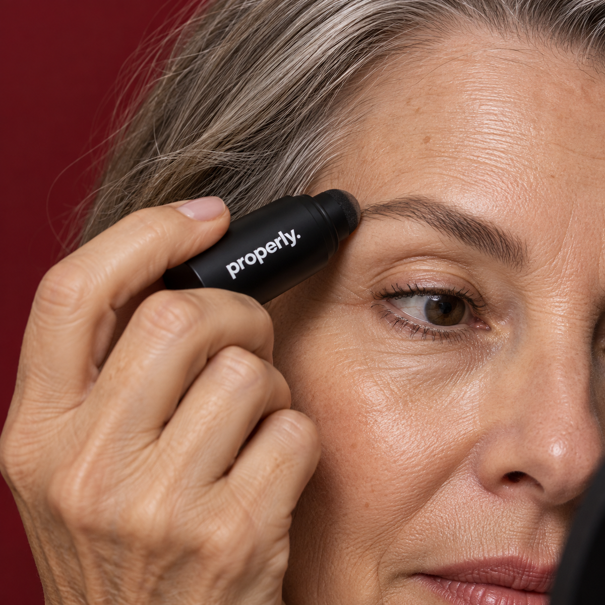 Properly brow stamp applied to a naturally defined mature brow
